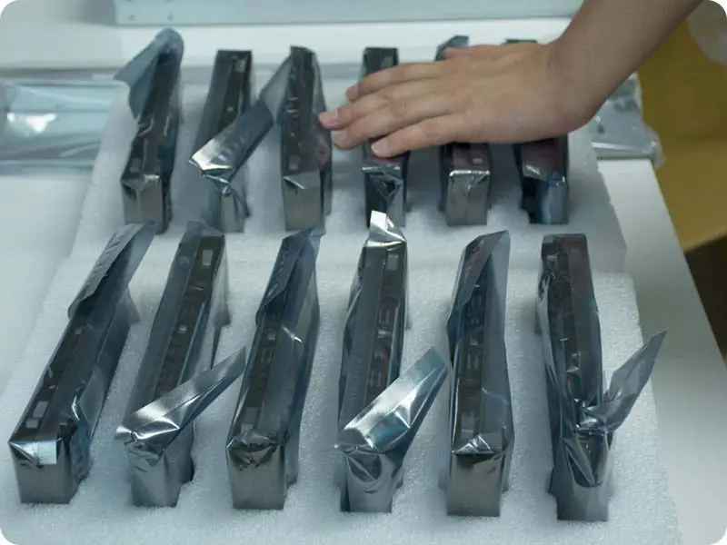 Hard drives in anti-static bags laid out in a foam tray, ready for archiving